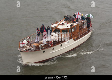 The Mimosa, a Dunkirk Little Ship proceeds along River Thames, as part of the Queen’s Thames Diamond Jubilee Pageant, taken from Tower Bridge, London, UK, 3rd June 2012. The Diamond Jubilee celebrates Queen Elizabeth the second’s 60 years as Head of the Commonwealth. Stock Photo