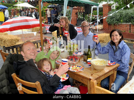 Brighton UK 5 June 2012 - Residents of East Drive Queens Park Brighton at their Queens Diamond Jubilee Street Party today despite the rain Stock Photo