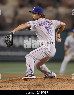 Yu Darvish (Rangers), MARCH 11, 2012 - MLB : Yu Darvish of the Texas Rangers  holds his teammate's son in his arms during the Texas Rangers spring  training camp in Surprise, Arizona