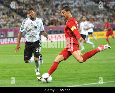 09.06.2012. Lvivi, Ukraine.  Portugal's Cristiano Ronaldo (R)delivers the ball past Germany's Jerome Boateng during UEFA EURO 2012 group B soccer match Germany vs Portugal at Arena Lviv in Lviv, the Ukraine, 09 June 2012. Stock Photo