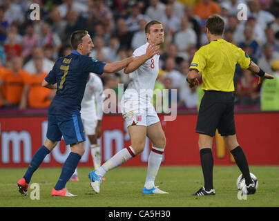 11.06.2012. Donetsk, Ukraine.  Italian referee Nicola Rizzoli (R) reprimands France's Franck Ribery (L) and England's Jordan Henderson during the UEFA EURO 2012 group D soccer match France vs England at Donbass Arena in Donetsk, the Ukraine, 11 June 2012. Stock Photo