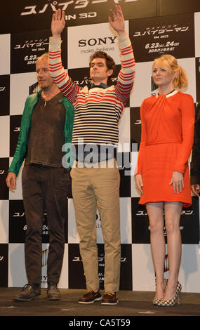 Tokyo, Japan - Andrew Garfield is flanked by Emma Stone and Rhys Ifans, left, as they pose for photographers during a news conference in Tokyo on Wednesday, June 13, 2012 to promote world premiere of The Amazing Spider-Man. Stock Photo