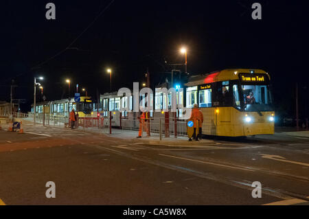 Wed 13th June 2012.  In the early hours of the morning a Manchester Metrolink tram makes the very first test run to Droylsden, Tameside, UK, on the street running section of the East Manchester Line.  The line is due to open to passenger traffic later this year. Stock Photo