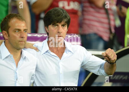 13.06.2012. Kharkiv, Ukraine. Germany's headcoach Joachim Loew (R)and assistant coach Hans-DieterFlick after the national anthem prior to the UEFA EURO 2012 group B soccer match the Netherlands vs Germany at Metalist Stadium in Kharkiv, the Ukraine, 13 June 2012. Stock Photo