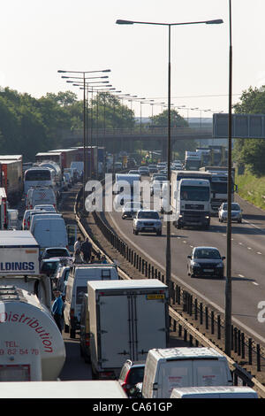 14 June 2012 M1 motorway Southbound Northamptonshire England UK. Lorry Crashed just before Junction 15A Driver critical. Air Ambulance at scene. Stock Photo