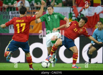 14.06.2012, GDANSK, Poland. Spain's David Silva (R)and Alvaro Arbiola challenge for the ball with Ireland's Stephen Ward during the UEFA EURO 2012 group C soccer match Spain vs Republic of Ireland at Arena Gdansk in Gdansk, Poland, 14 June 2012. Stock Photo