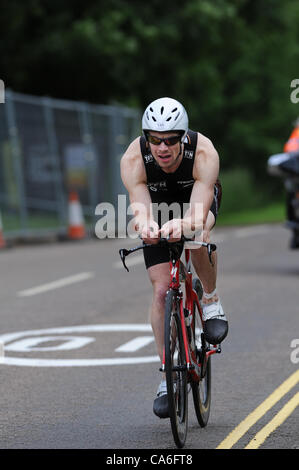 The second leg of the Dambuster Triatholon 2012 is a 42 kilometre bike ride around the Rutland reservoir, mostly on public roads. The winer, shown here, took about an hour. Stock Photo