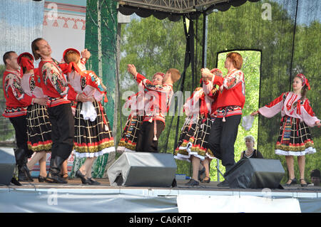 Folklore vocal and dance ensemble 'Lyubota' (Russia) perform on stage Stock Photo