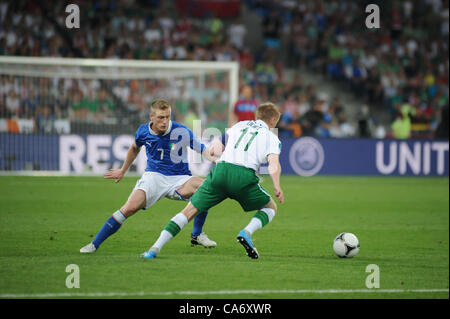 18.06.2012 , Poznan, Poland.Damien Duff (Fulham FC) in action for Rep of Ireland and Ignazio Abate (AC Milan) in action for Italy during the European Championship Group C game between Italy and Ireland from the Municipal Stadium. Stock Photo