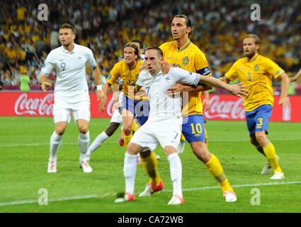 19.06.2012. Kiev, Ukraine. France's Franck Ribery holds off Sweden's Zlatan Ibrahimovic during UEFA EURO 2012 group D soccer match Sweden vs France at NSC Olimpiyskiy Olympic stadium in Kiev, the Ukraine, 19 June 2012. Stock Photo