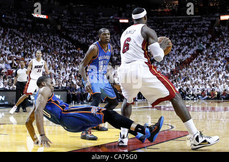 19.06.2012. Miami, Florida, USA.  Miami Heat small forward LeBron James (6) posts up Oklahoma City Thunder point guard Russell Westbrook (0) who fells during the Miami Heat 104-98 victory over the Oklahoma City Thunder, in Game 4 of the 2012 NBA Finals, at the American Airlines Arena, Miami, Florida, USA. Stock Photo