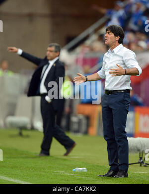 22.06.2012. Gdansk, Poland.  Germany's coach Joachim Loew watches the game next to Greece's coach Fernando Santos during the UEFA EURO 2012 quarter-final soccer match Germany vs Greece at Arena Gdansk in Gdansk, Poland, 22 June 2012. Stock Photo