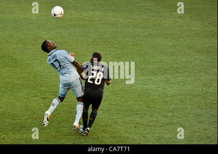 Philadelphia, USA. 23 June, 2012. Ray Gaddis and CJ Sapong battle for the ball during a professional MLS soccer / football match against the Sporting KC of Kansas City. Stock Photo