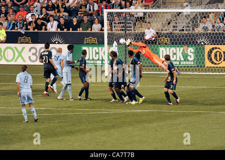 Philadelphia, USA. 23 June, 2012. Philadelphia Union goalie Zac MacMath leaps and steers a ball away from the cage during a professional MLS soccer / football match against the Sporting KC of Kansas City. Stock Photo