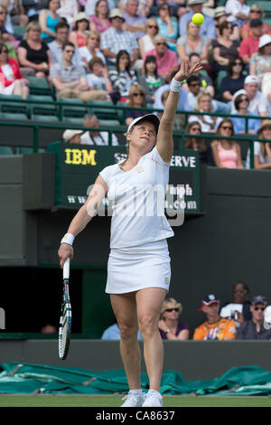 25.06.2012 London, England Kim Clijsters of Belgium  in action against Jelena Jankovic of Serbia during the first round of the match at Wimbledon Tennis Championships at The All England Lawn Tennis Club. Stock Photo