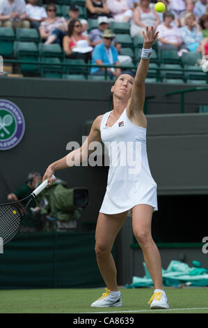 25.06.2012 London, England  Jelena Jankovic of Serbia in action against Kim Clijsters of Belgium during the first round of the match at Wimbledon Tennis Championships at The All England Lawn Tennis Club. Stock Photo