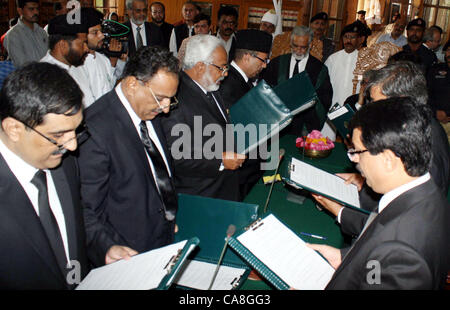 Sindh High Court Chief Justice, Justice Mushir Alam  administers oath from additional judges during oath taking ceremony held at SHC building in  Karachi on Wednesday, June 27, 2012. Stock Photo