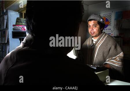 (published 12/30/2004, E-3) Daniel Monroy (cq) a clerk at Third Avenue News in Chula Vista talks with a customer. Daniel lives in Serra Mesa. Roni Galgano/Union-Tribune Stock Photo