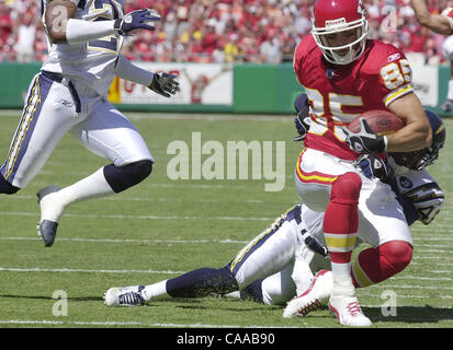 FOX2000010205 - 02 JANUARY 2000 - FOXBORO, MASSACHUSETTS, USA: The  Baltimore Ravens Priest Holmes, front, runs around the New England Patriots  Andy Katzenmoyer, January 2, at Foxboro Stadium in Foxboro. The Bills