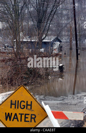 Feb 26, 2003 - Cincinnati, Ohio, USA - The rising waters of the Ohio River continue to swell to a flood stage of 52 feet, 26 feet over normal levels. Rising to a 6 year high, the water has covered the parking lots of restaurants, riverfront homes, flooded boat harbors, covered some low laying roads, Stock Photo