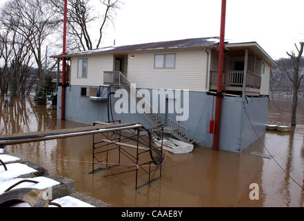 Feb 26, 2003 - Cincinnati, Ohio, USA - The rising waters of the Ohio River continue to swell to a flood stage of 52 feet, 26 feet over normal levels. Rising to a 6 year high, the water has covered the parking lots of restaurants, riverfront homes, flooded boat harbors, covered some low laying roads, Stock Photo