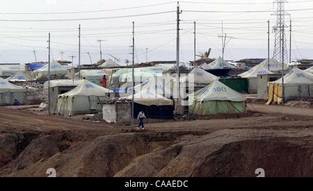 (Published 03/08/2003, A-18) NC CHAMCHAMAL x008  Northern Iraq, March 5, 2003 ............    The Takia Refugee Camp in Northern Iraq, about 10k from the border checkpoint at Chamchamal, Iraq.  Must folks live in a canvas tent with concrete flooring.  And many of the tents are elaborately setup next Stock Photo