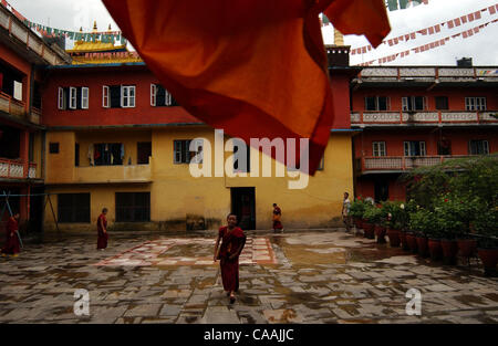 KATHMANDU, NEPAL-AUGUST 22, 2003  Monk get out from the class during the break time at Sakya Tharig, Tibetan Budhist Monastery at Boudhanath . There are currently arround 120.000 Tibetans in exile, and some 12.000 of them are in Nepal. Many of them are refugees who fled their country following the i Stock Photo