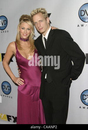 Dec 02, 2003 - Hollywood, California, USA - Jenny McCarthy & husband John Asher at the DVD Exclusive Awards held at Wiltern theatre. Stock Photo