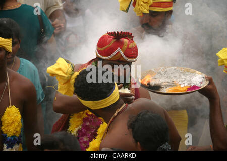 KUALA LUMPUR, MALAYSIA FEBRUARY 5, 2004  A devotee receives blessings as he passes through the crowd on his way to the temple at the Batu Caves during Thaipusam festival, February 5. 2004. More than 1 million people, in two days of almost unbroken procession, climb steep steps to the entrance of the Stock Photo