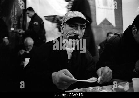 A free dinner for thousands is served in Taksim Square, Istanbul, on the first night of Ramadan, the Moslem month of fasting. Moslems do not eat from sunrise to sunset during the month of Ramadan. Stock Photo