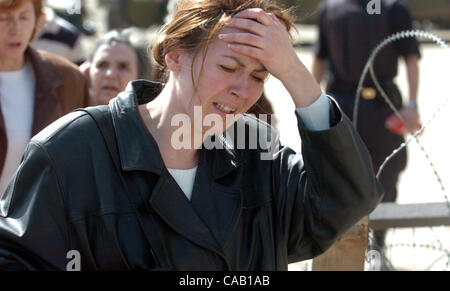 Mar 22, 2004; Kosovo, SERBIA; A Serbian women cries while leaving her home. Her family was expelled from their home by ethnic Albanians. KFOR soldiers escort them to the closest refugee center in Kosovska Mitrovica. The worst ethnic violence since the 1998-1999 Kosovo war erupted here and spread to  Stock Photo