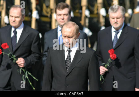 The president of Russia Vladimir Putin on putting on of a wreath to the Tomb of the Unknown Soldier in Aleksandrovsk to a garden at the Kremlin wall. In solemn ceremony have taken part chairman of the Constitutional court Valery Zorkin (at the left), the chapter of administration of president Dmitry Stock Photo