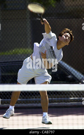 Alameda's Tommy Tu hits a strong serve enroute to defeating University's J.C. Hanley 6-1, 6-0, in first round action of NCS team tennis championships at Alameda High School in Alameda, Calif., on Tuesday, May 11, 2004. (CONTRA COSTA TIMES/EDDIE LEDESMA) Stock Photo