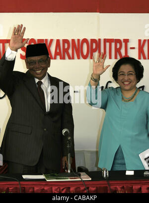 JAKARTA, INDONESIA MAY 31, 2004  Indonesian President Megawati Sukarnoputri (R) speaks to journalists during a press conference at her official residence in Jakarta, accompanied by her vice presidential candidate for the July presidential polls Hasyim Muzadi (L). Megawati defended government moves a Stock Photo