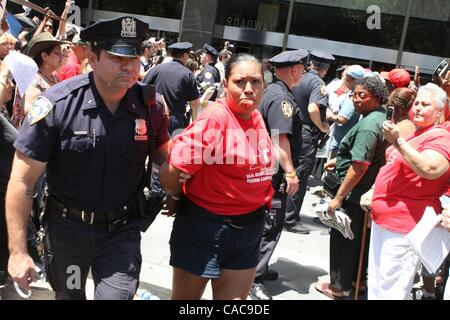 Jul 11, 2010 - New York, New York, U.S. - Tenants are arrested in protest of Sate Senate inaction on restoration of rent law protections at 250 Broadway in Manhattan. (Credit Image: Â© Mariela Lombard/ZUMApress.com) Stock Photo