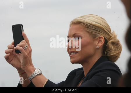 Kelly Ripa of the "Regis & Kelly" show with Anderson Cooper. Hundreds