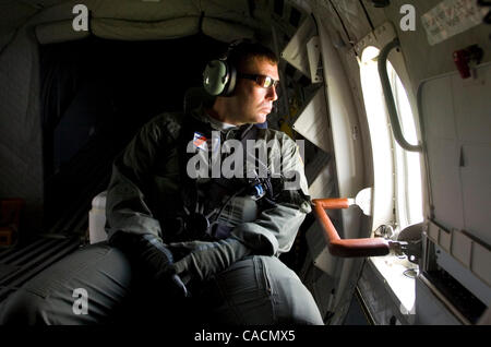 June 13, 2010 - Houma, LOUISIANA, U.S. - US Coast Guard Petty Officer Jason Smith looks out the window of his aircraft during takeoff from the Houma Terrebonne Airport for a flight over the BP Deepwater Horizon oil spill in the Gulf of Mexico off the coast of Louisiana, USA 13 June 2010. The BP Deep Stock Photo