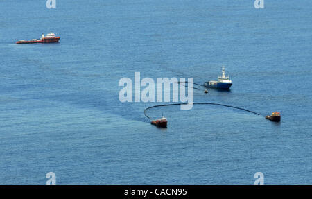 June 25, 2010 - Venice, LOUISIANA, U.S. - Vessels are seen skimming for oil the site of the BP Deepwater Horizon oil well spill site in the Gulf of Mexico off the coast of Louisiana, USA 25 June 2010, during a US Coast Guard overflight. The BP Deepwater Horizon oil spill, which began over two months Stock Photo