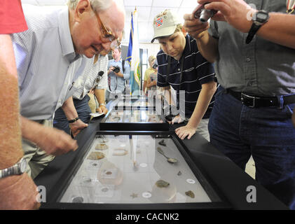 Aug. 18, 2010 - Millen, GEORGIA, U.S. - Local residents look at some of the artifacts unearthed from the newly discovered Camp Lawton, a short-lived Confederate Civil War prison camp to house captured Union soldiers on 18 August 2010, outside of Millen, Georgia, USA. Archaeologists from Georgia Sout Stock Photo