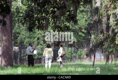 Aug. 18, 2010 - Millen, GEORGIA, U.S. - People stand outside the fence line of the newly discovered Camp Lawton, a short-lived Confederate Civil War prison camp to house captured Union soldiers on 18 August 2010, outside of Millen, Georgia, USA. Archaeologists from Georgia Southern University and th Stock Photo