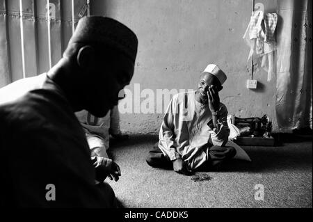 Aug. 5, 2010 - Kano, KANO, NIGERIA - Kabiru Nuhu, 50, has suffered from polio for many years. He and his  wife and children have survived with aid from the Kano State Polio Victims Trust Association. He sits in his home in Kano, Nigeria. .Religious zealotry and misinformation have coerced villagers  Stock Photo