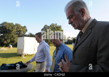Sep 08, 2010 - Gainesville, Florida, USA - Rev. TERRY JONES, right, walks back to his church building after speaking to the media outside the Dove World Outreach Center in Gainesville. The church's pastor, Rev. Terry Jones has threatened to burn 200 Qurans to mark the anniversary of the Sept. 11 ter Stock Photo