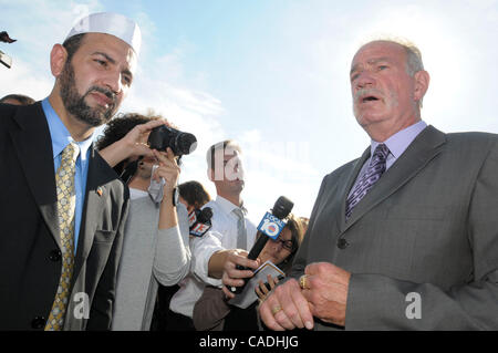 Sep 09, 2010 - Gainesville, Florida, U.S. - Rev. TERRY JONES, right, pastor of the Dove World Outreach Center, and IMAM MUHAMMAD Musri, left, president of the Islamic Society of Central Florida, answer questions from reporters after announcing the cancellation of the planned Quran burning outside Jo Stock Photo