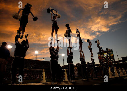 Sept. 11, 2010 - Lexington, Kentucky, USA -  University of Kentucky cheerleaders were sillhouetted against a colorful sunset as the University of Kentucky played Western Kentucky University at Commonwealth Stadium. Kentucky won the game, 63-28. (Credit Image: © David Stephenson/ZUMApress.com) Stock Photo