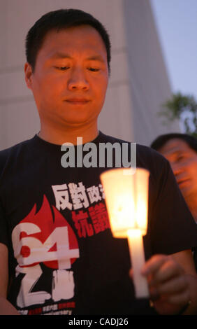 Wang Dan, former student leader of the 1989 Tiananmen Square Democracy Movement, joins a candlelight vigil in front of the People's Republic of China Consulate in Los Angeles Monday night, June 4, 2010, to mark the 21st anniversary of the military crackdown on the 1989 student-led pro-democracy move Stock Photo