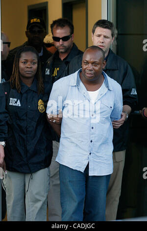 Jun. 25, 2010 - White Plains, New York, USA - Jamaican gang leader and drug lord CHRISTOPHER 'DUDUS' COKE, 42, is escorted by DEA agents from the Avitat terminal at the Westchester County airport to a waiting vehicle June 24. Coke arrived in the United States after being extradited from Jamaica to f Stock Photo