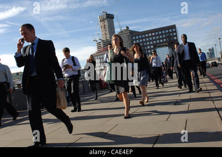 Aug 27, 2010 - London, England, United Kingdom - Every weekday 'river' of city workers cross London Bridge during the morning rush-hour in the City of London. (Credit Image: © Sergei Bachlakov/ZUMApress.com) Stock Photo