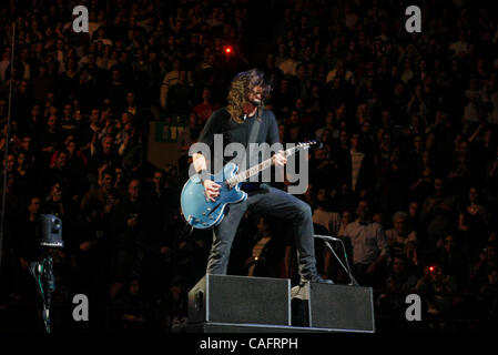 The Foo Fighters with Dave Grohl lead vocals performing at Madison Square Garden on February 19, 2008.  Dave Grohl - lead vox and guitar (beard, long black hair) Nate Mendel - bass,Taylor Hawkins - drums, Chris Shiflett - guitar Stock Photo