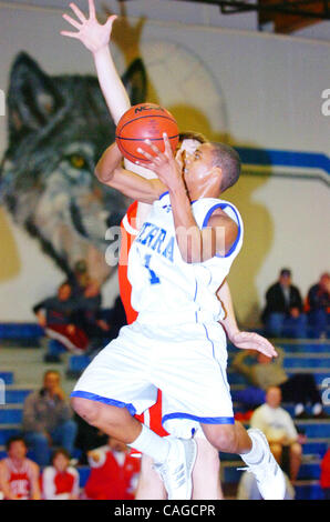 Sierra High basketball player Christian Williams tries for a shot as Ceres' Thomas Vanderlaan defends during their game at Sierra High on Wednesday, February 6, 2008 in Manteca, Calif.(Gina Halferty/San Joaquin Herald) Stock Photo