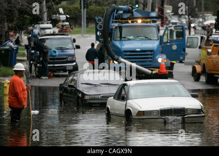 Jan 25, 2008 - Los Angeles, CA, USA - Heavy rains in Southern California led to street flooding on Rossmore Ave in the Hancock Park of Los Angeles when storm drains became clogged by debris. A very large storm is predicted to hit the area again on Saturday.  Photo by Jonathan Alcorn/ZUMA Press. © Co Stock Photo